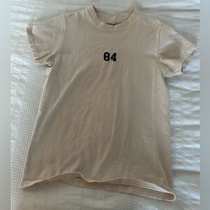 Brandy Melville Tan Tee with Black '84'
